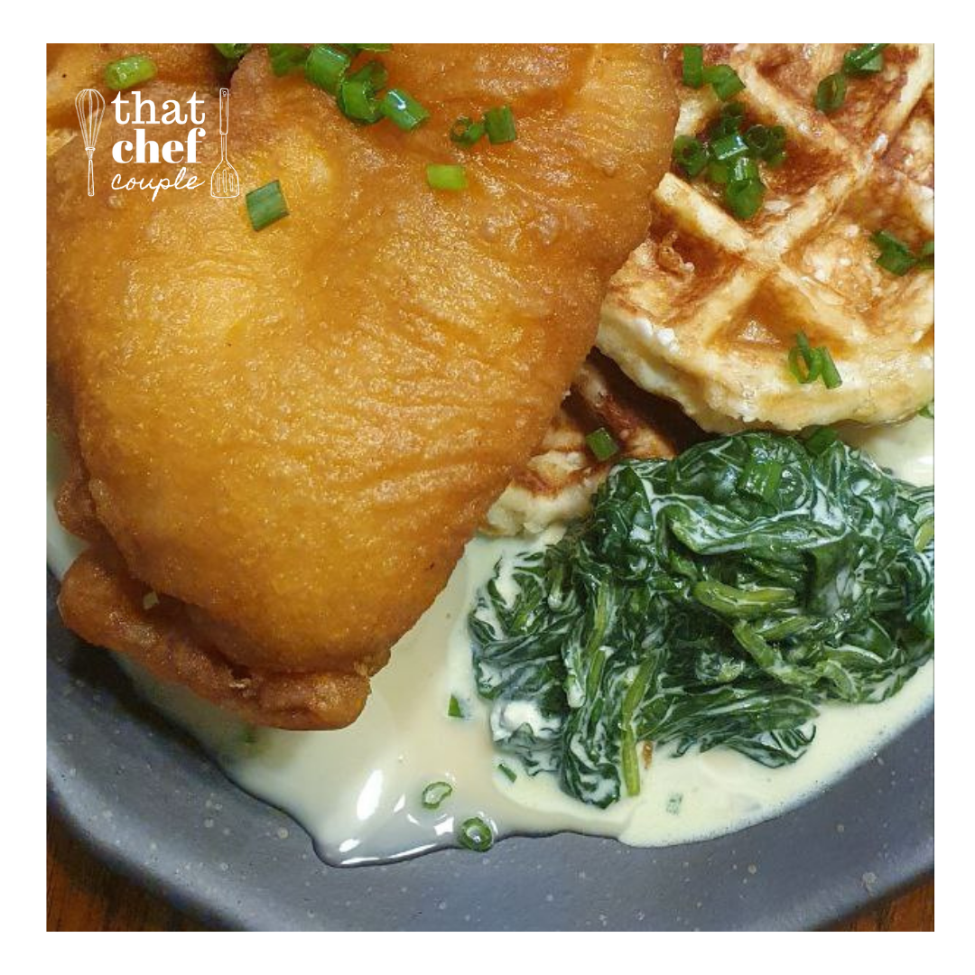 golden battered chicken with belgian waffle, maple mayo and creamed spinach
