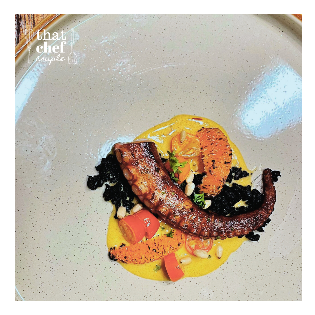 Smokey octopus with squid ink risotto and cognac sauce