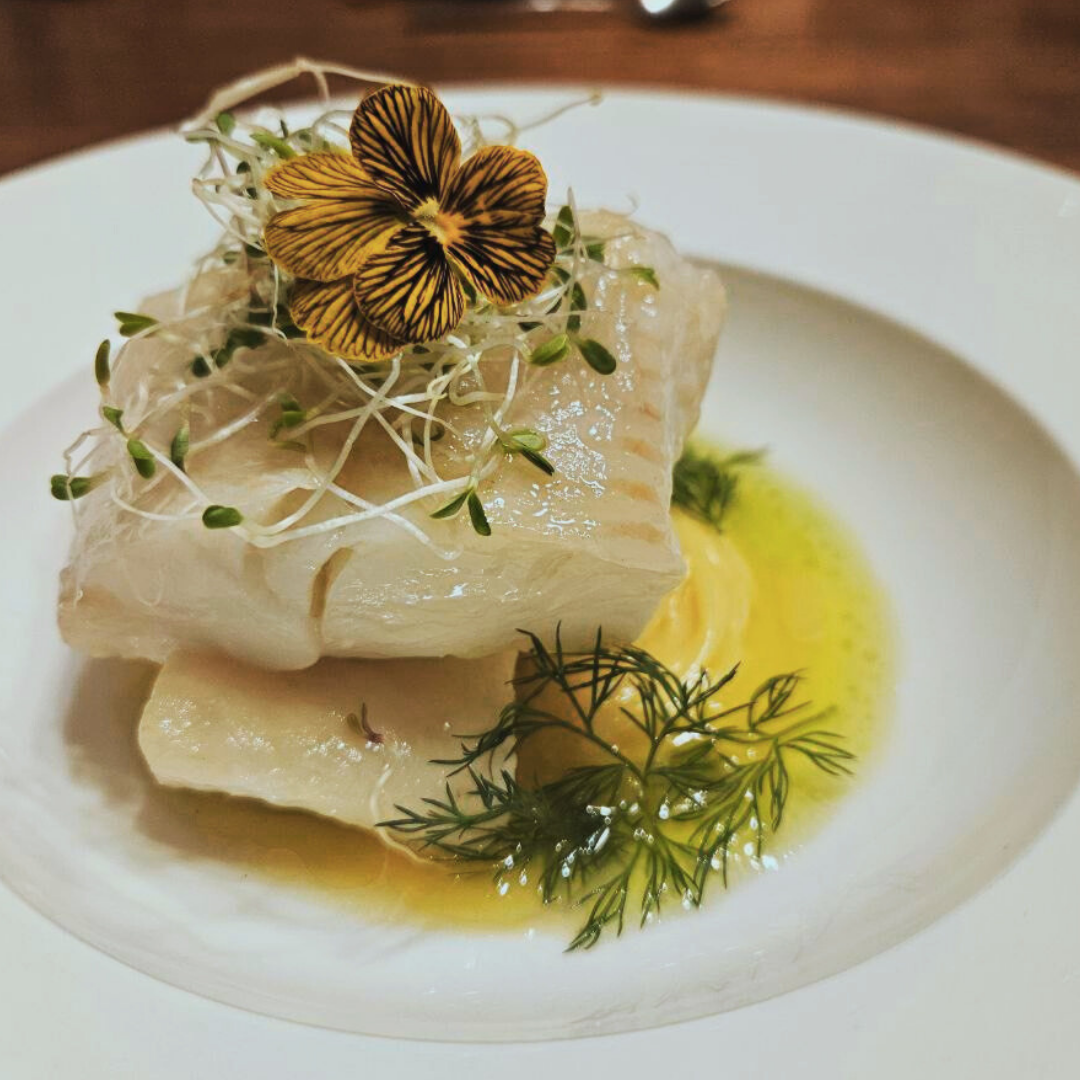 Oil-poached halibut with pea, edamame and dill puree, microgreens, saffron beurre blanc, dill-parsley oil