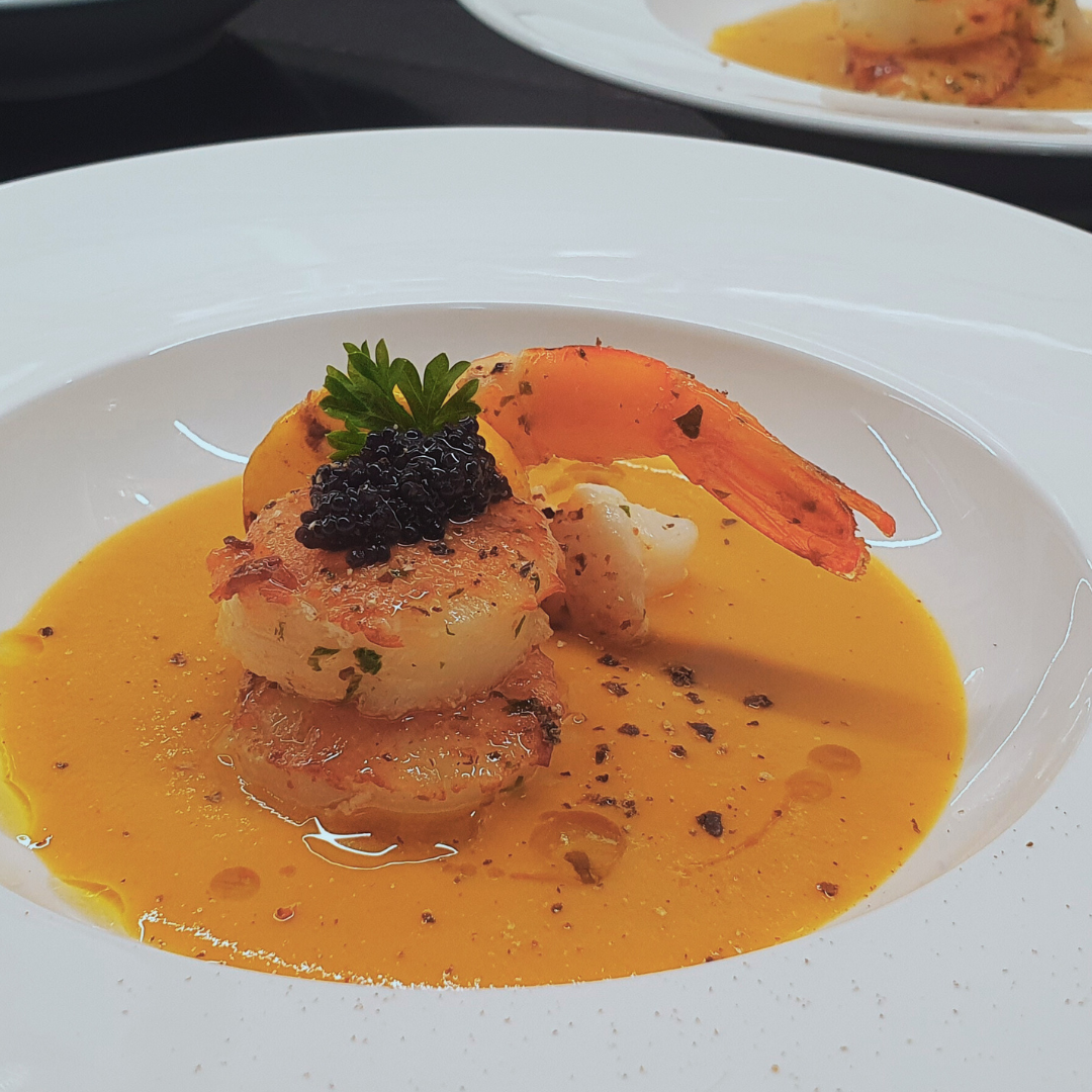 Shrimp bisque with pan-seared shrimp and scallop