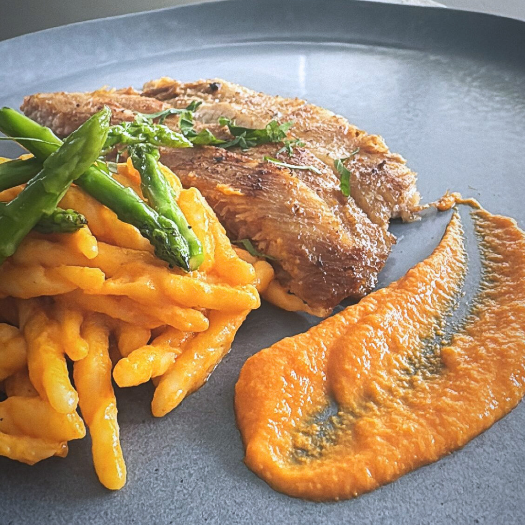 Miso pork jowl with romesco trofie and asparagus spears